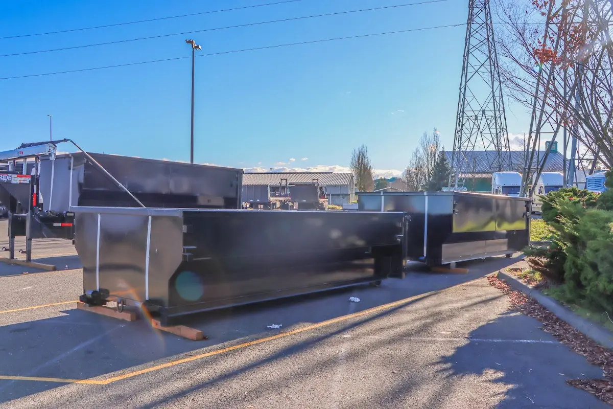 Roll-off dumpster ready for waste disposal at job site for 2 Yard Dumpster Rental in Granby